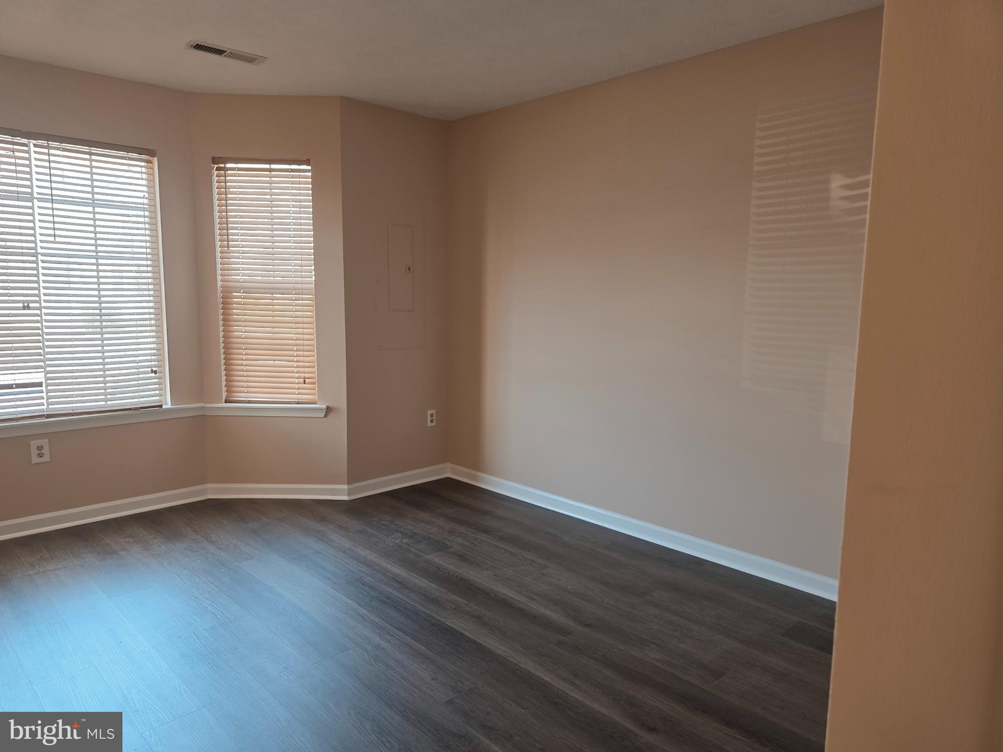 80 Stadium Circle Inwood, WV 25428 - Photo 11 of 53 an empty room with wooden floor and windows