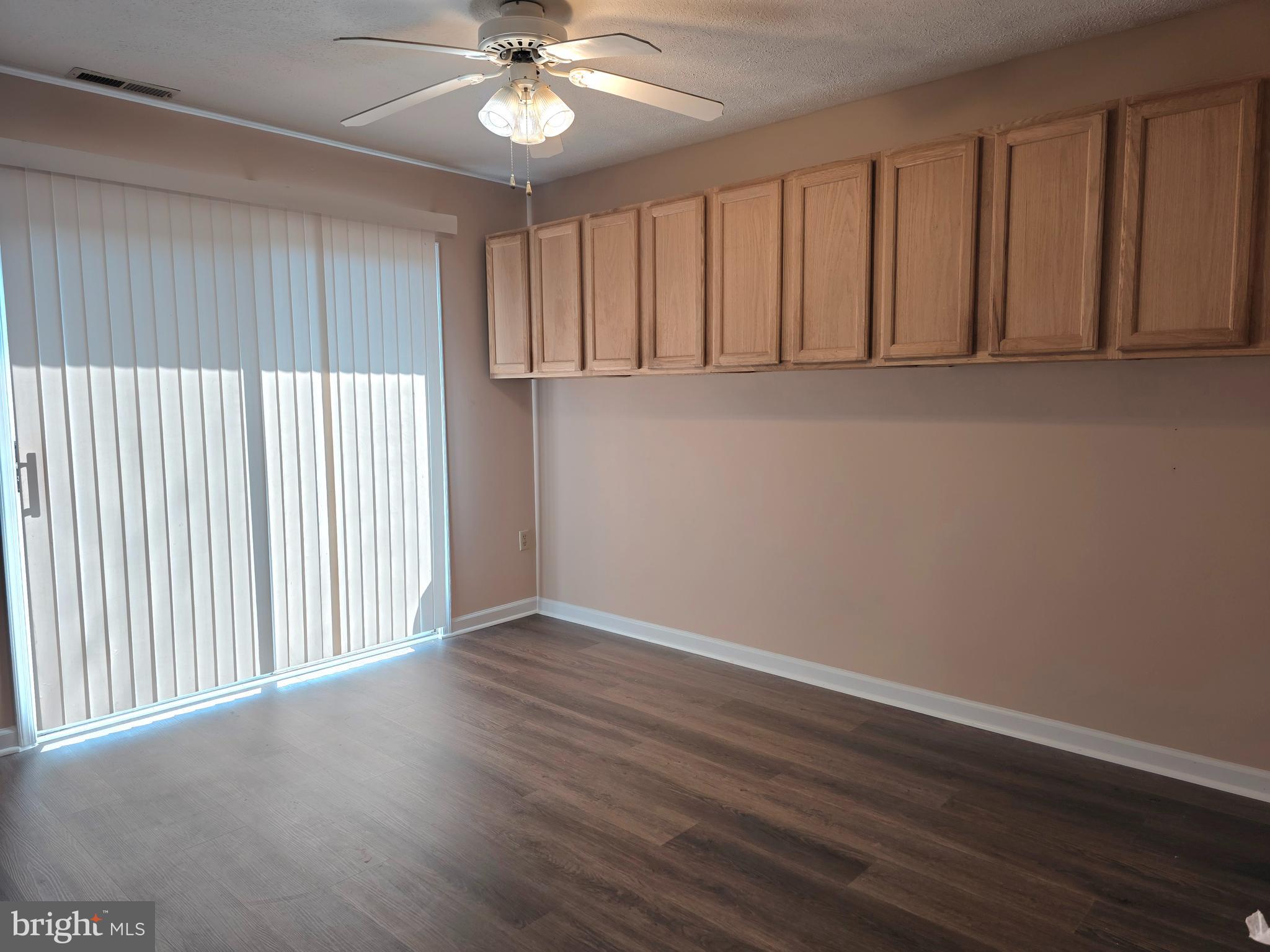 80 Stadium Circle Inwood, WV 25428 - Photo 13 of 53 a view of an empty room with wooden floor and a window