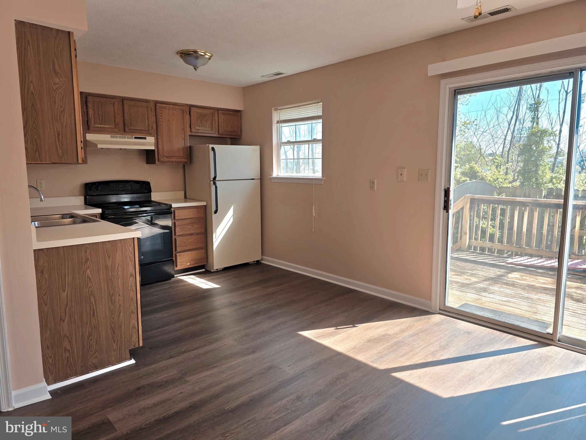 80 Stadium Circle Inwood, WV 25428 - Photo 30 of 53 a kitchen with a refrigerator wooden floor and window
