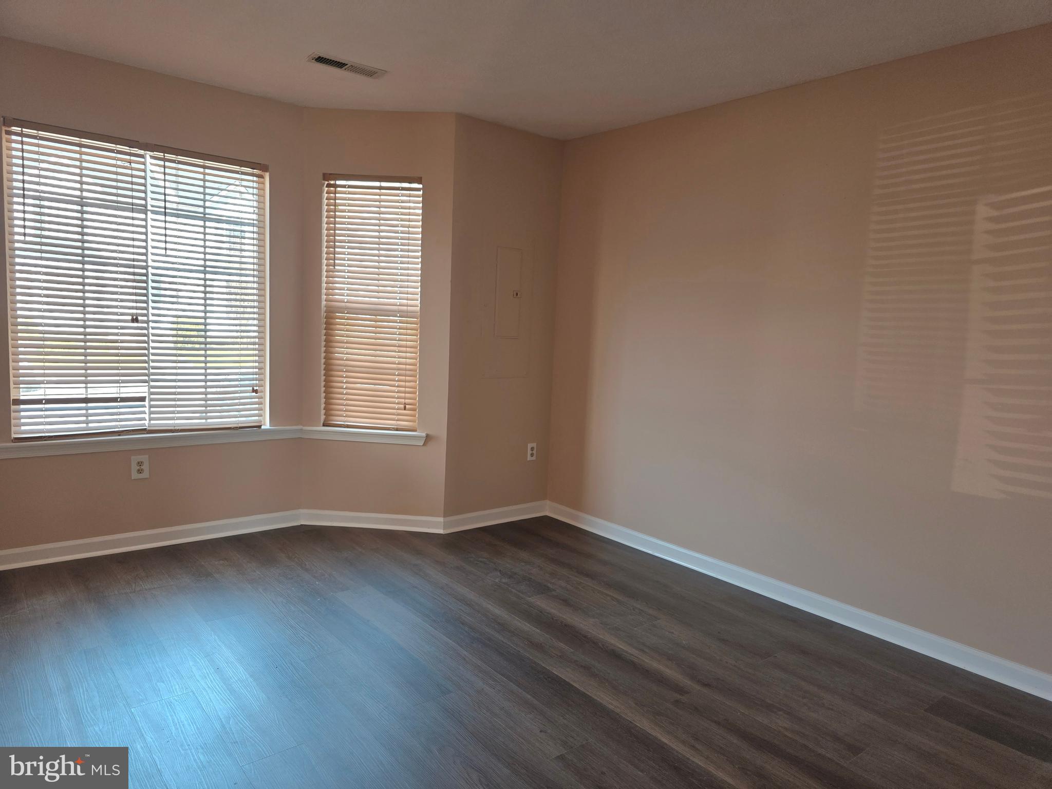 80 Stadium Circle Inwood, WV 25428 - Photo 34 of 53 an empty room with wooden floor and windows