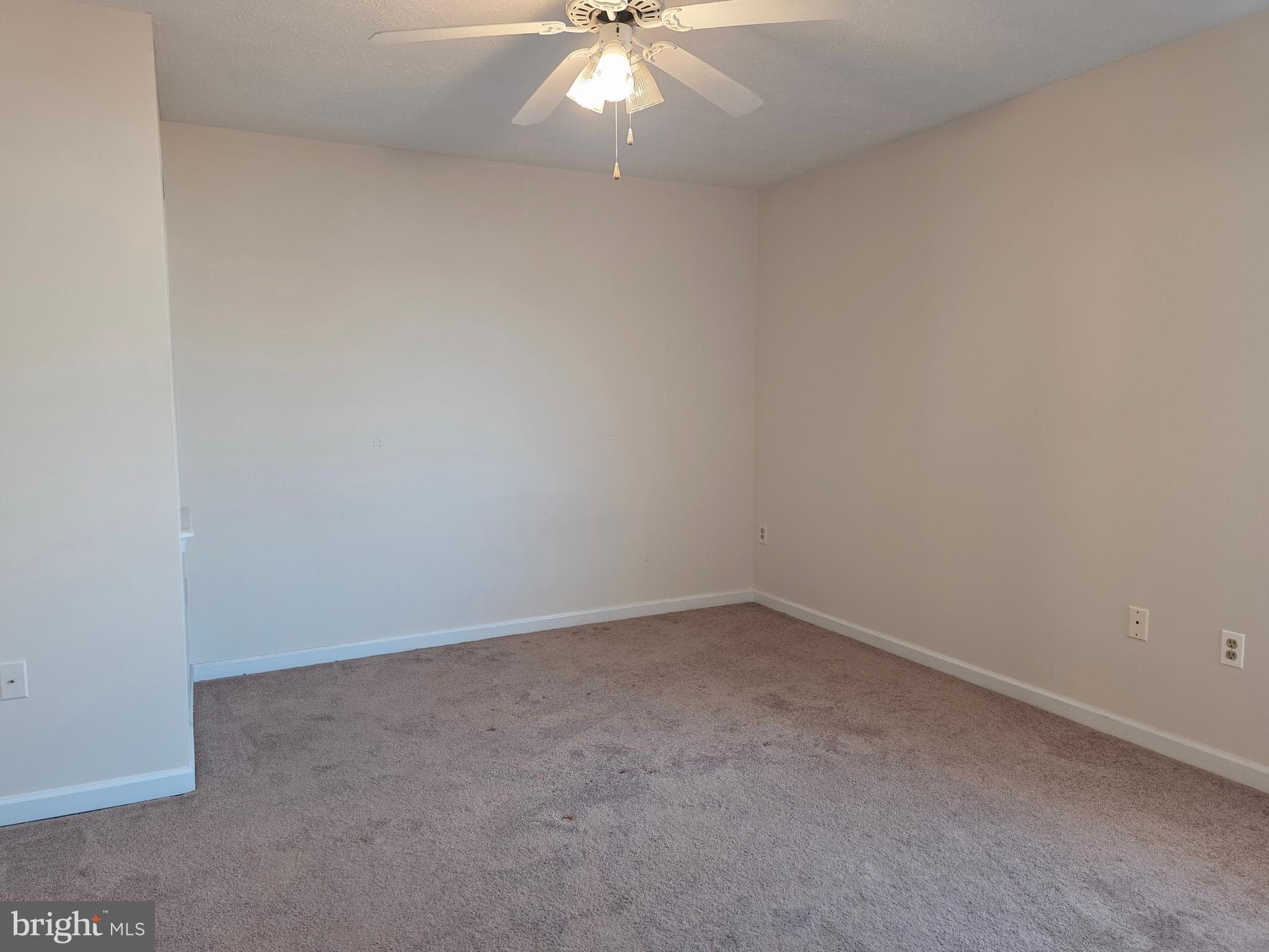 80 Stadium Circle Inwood, WV 25428 - Photo 40 of 53 an empty room with a window and a fan