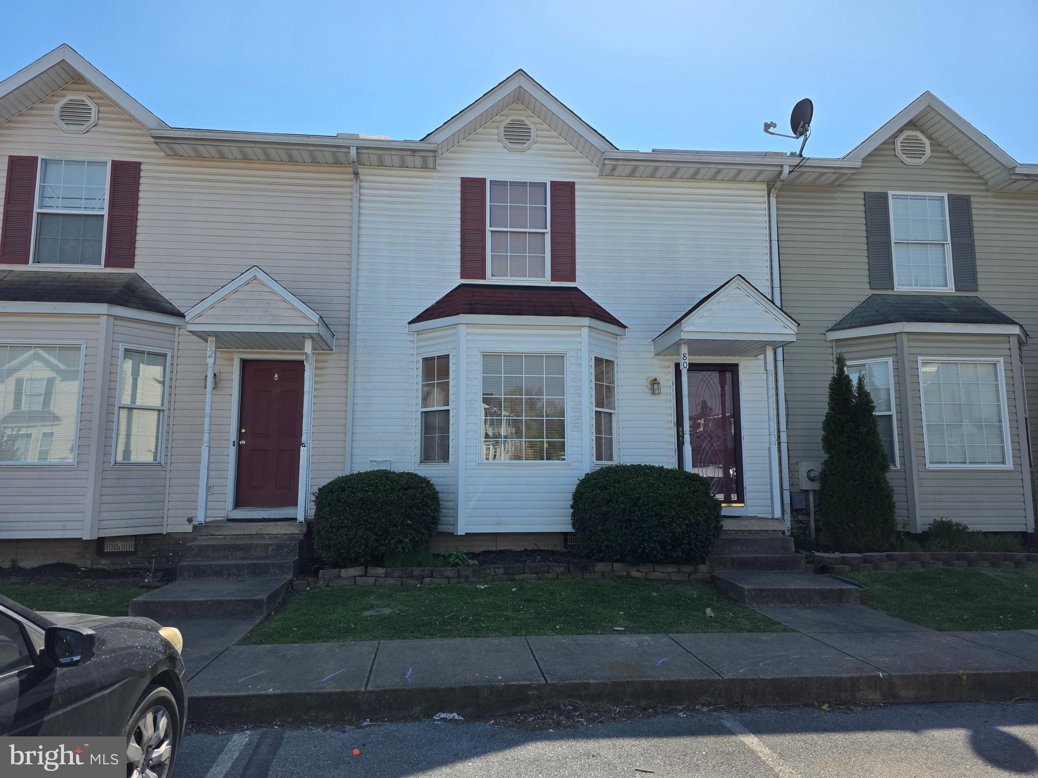 80 Stadium Circle Inwood, WV 25428 - Photo 4 of 53 a front view of a house with a yard and garage