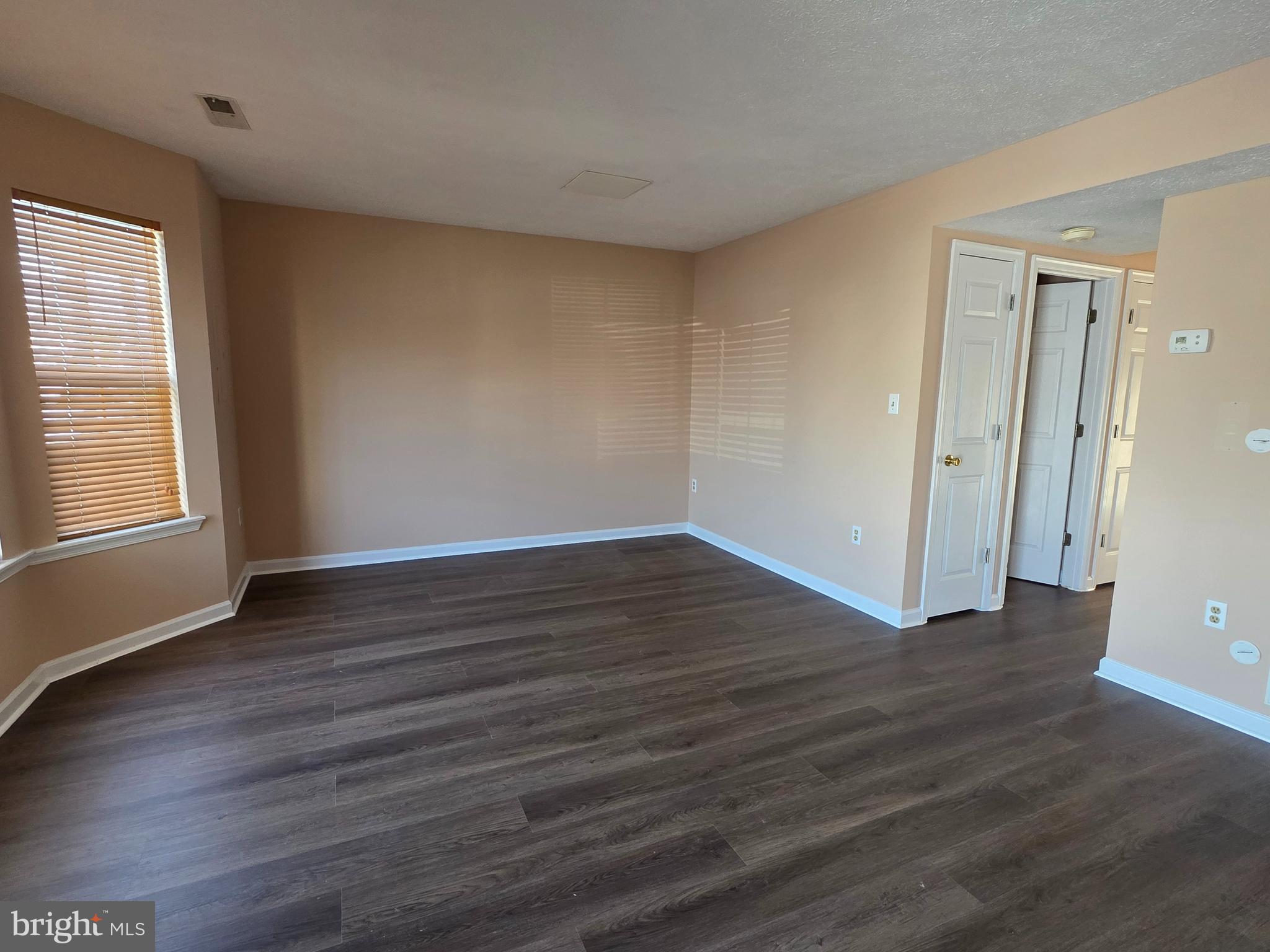 80 Stadium Circle Inwood, WV 25428 - Photo 6 of 53 an empty room with wooden floor and windows