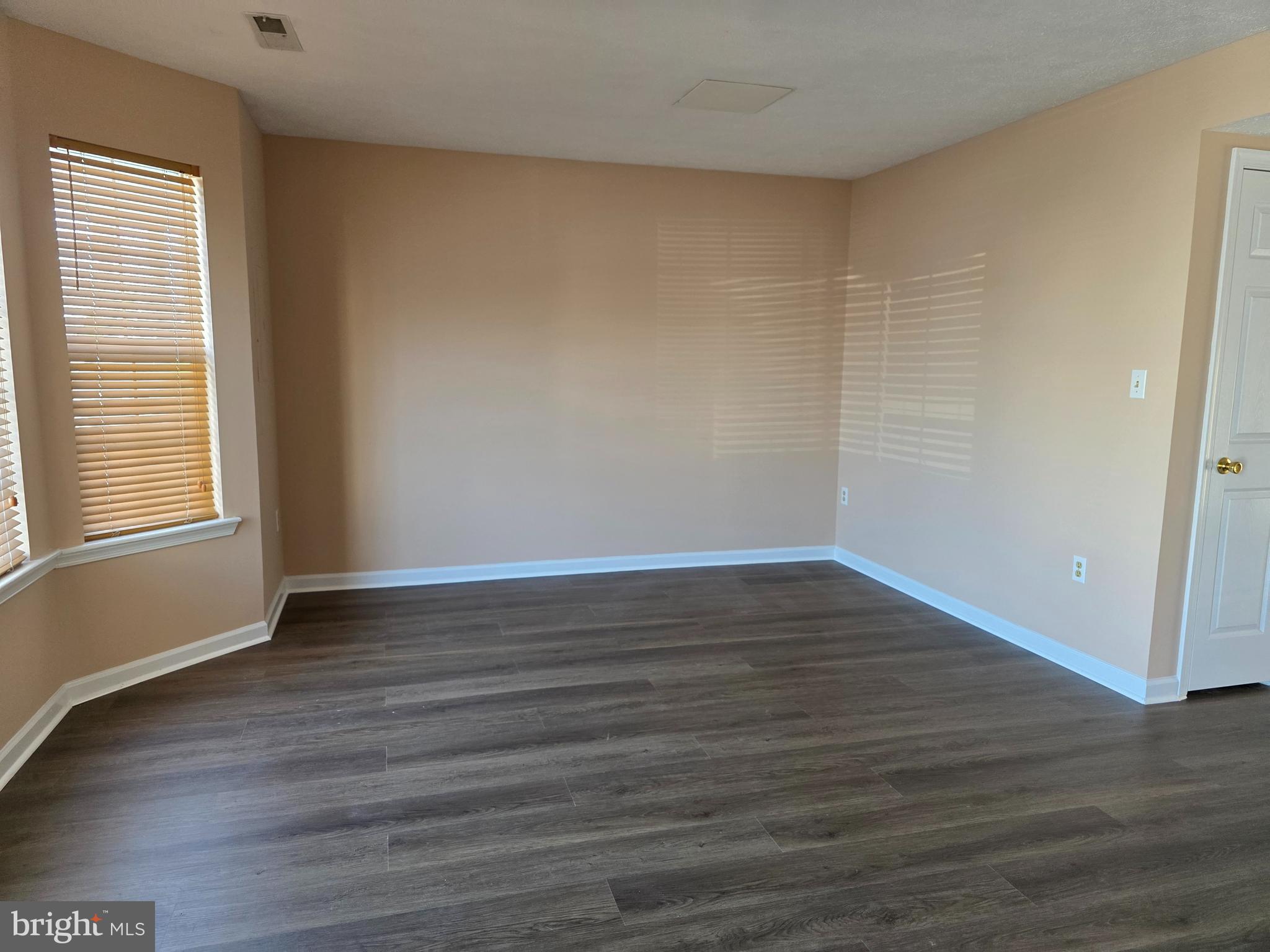 80 Stadium Circle Inwood, WV 25428 - Photo 7 of 53 a view of an empty room with wooden floor and a window