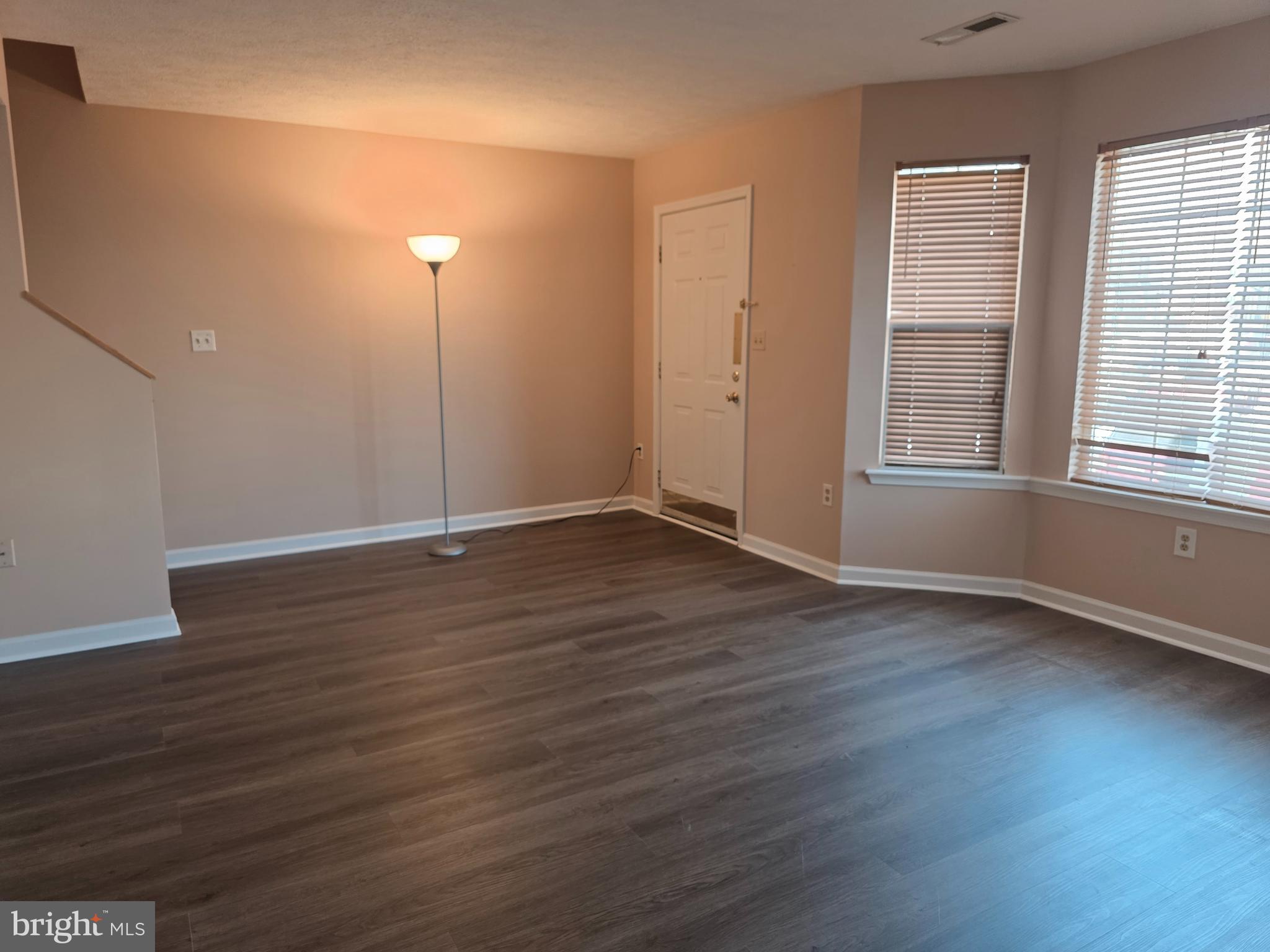 80 Stadium Circle Inwood, WV 25428 - Photo 9 of 53 an empty room with wooden floor and windows