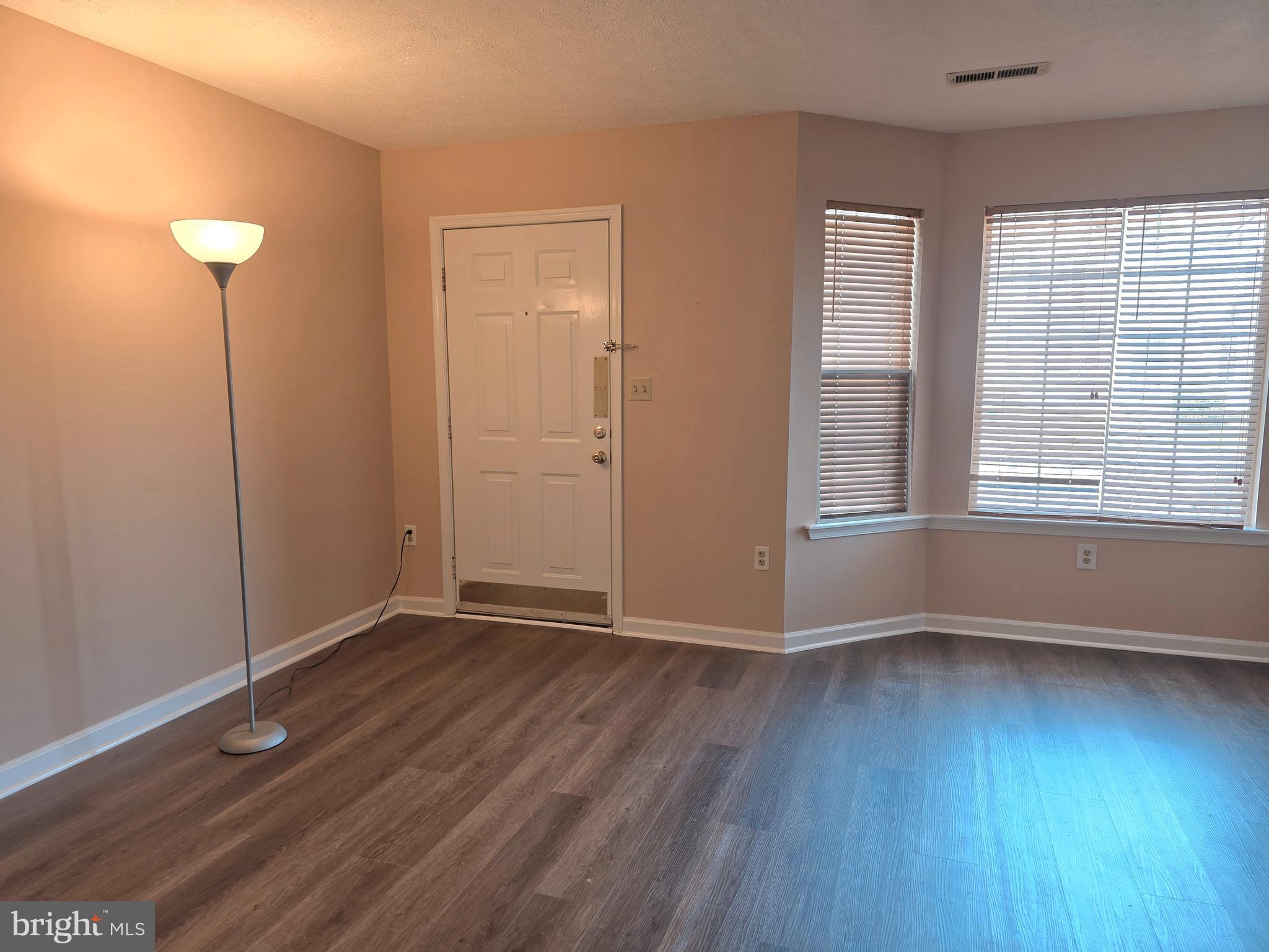 80 Stadium Circle Inwood, WV 25428 - Photo 10 of 53 an empty room with wooden floor and windows