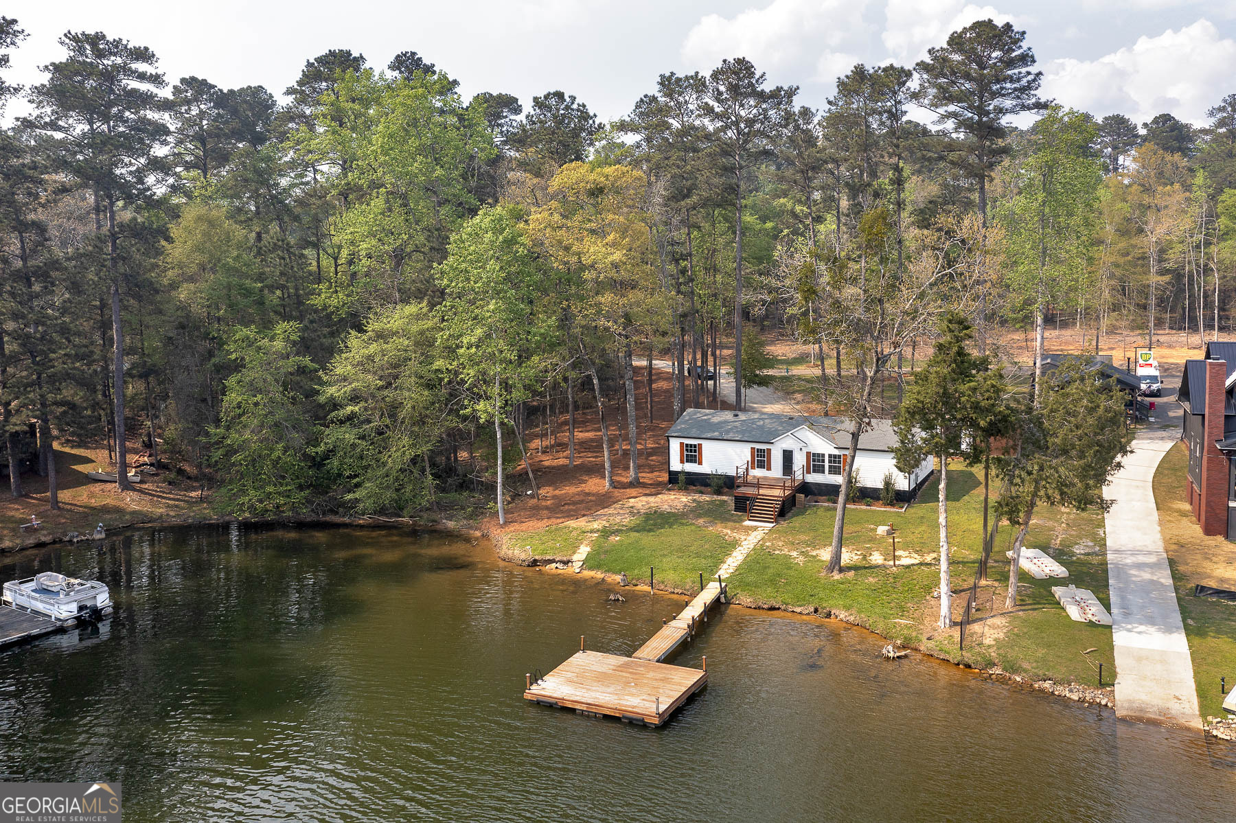 595 Barnetts Bridge Road Jackson, GA 30233 - Photo 40 of 47 a view of a lake with houses