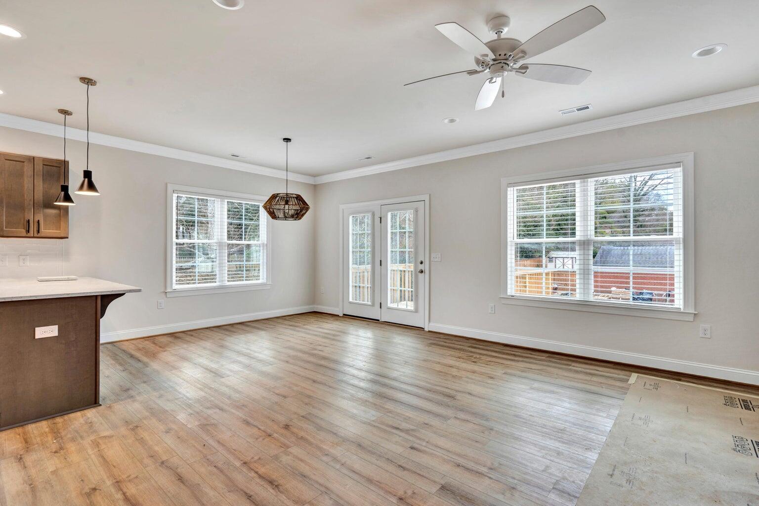 562 Dillard Road Southwest Roanoke, VA 24014 - Photo 5 of 13 a view of an empty room with a window and wooden floor