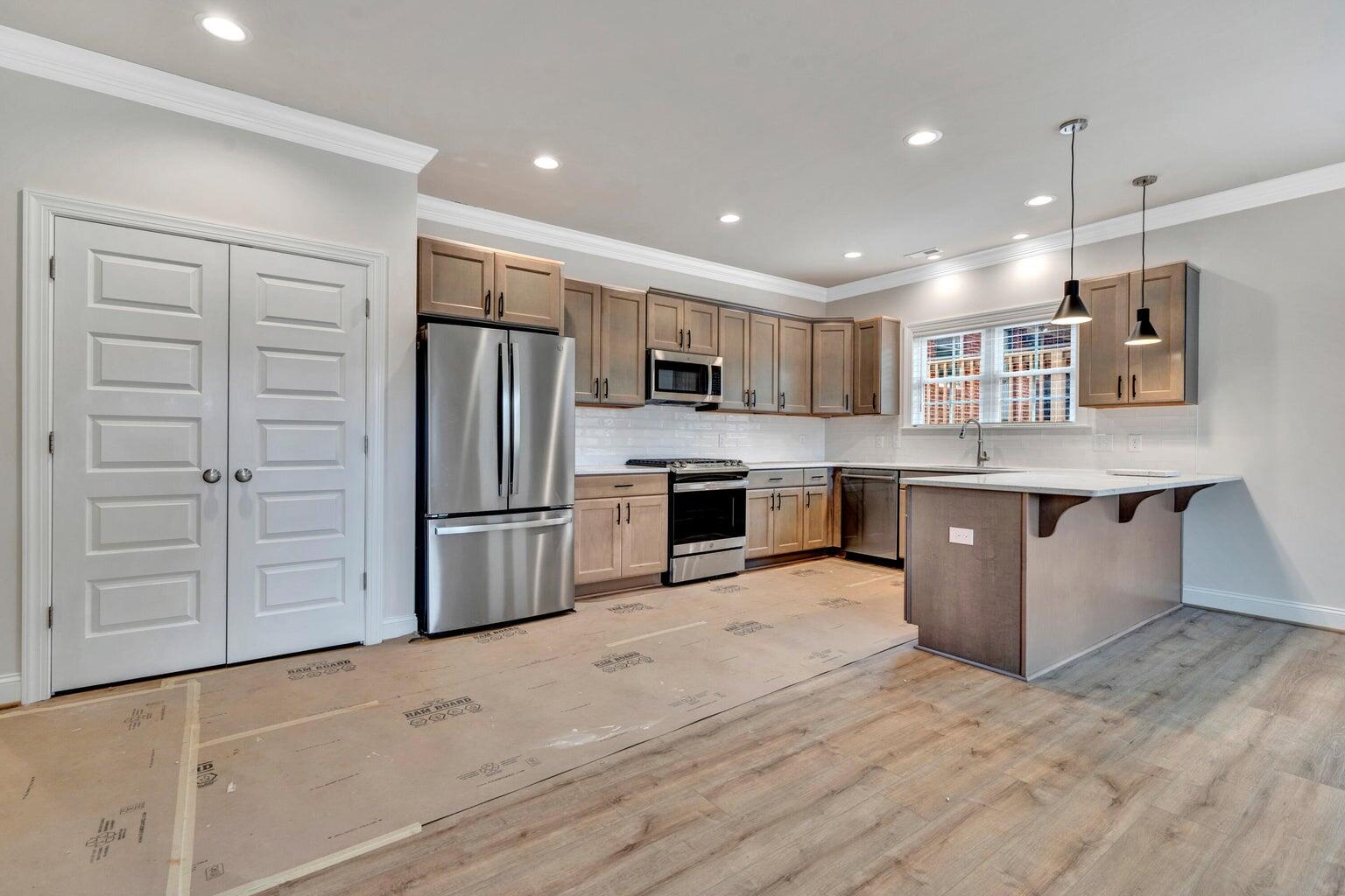 562 Dillard Road Southwest Roanoke, VA 24014 - Photo 6 of 13 a kitchen with stainless steel appliances granite countertop a refrigerator and a stove top oven