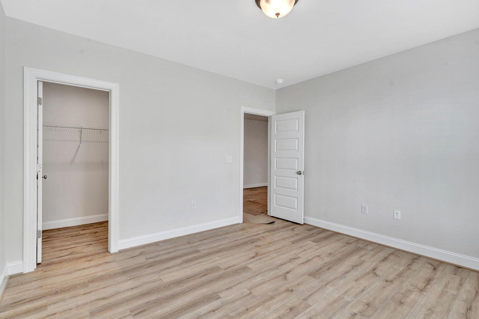 562 Dillard Road Southwest Roanoke, VA 24014 - Photo 9 of 13 an empty room with wooden floor & closet area