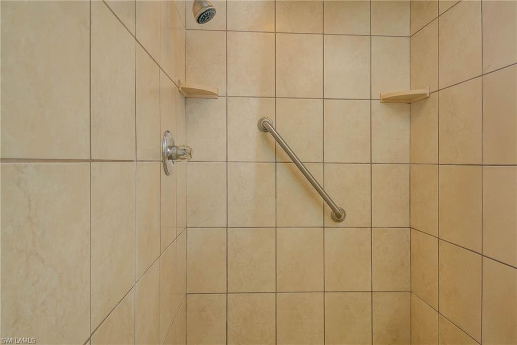 3030 Binnacle Drive, Unit 305 Naples, FL 34103 - Photo 21 of 25 a bathroom with a shower