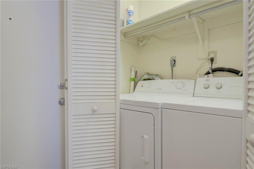 3030 Binnacle Drive, Unit 305 Naples, FL 34103 - Photo 23 of 25 a utility room with dryer and washer