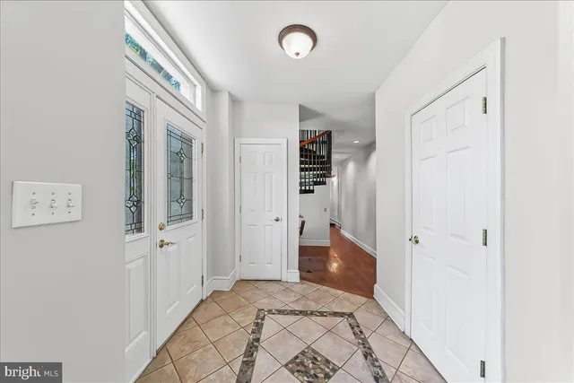 wooden floor with white walls