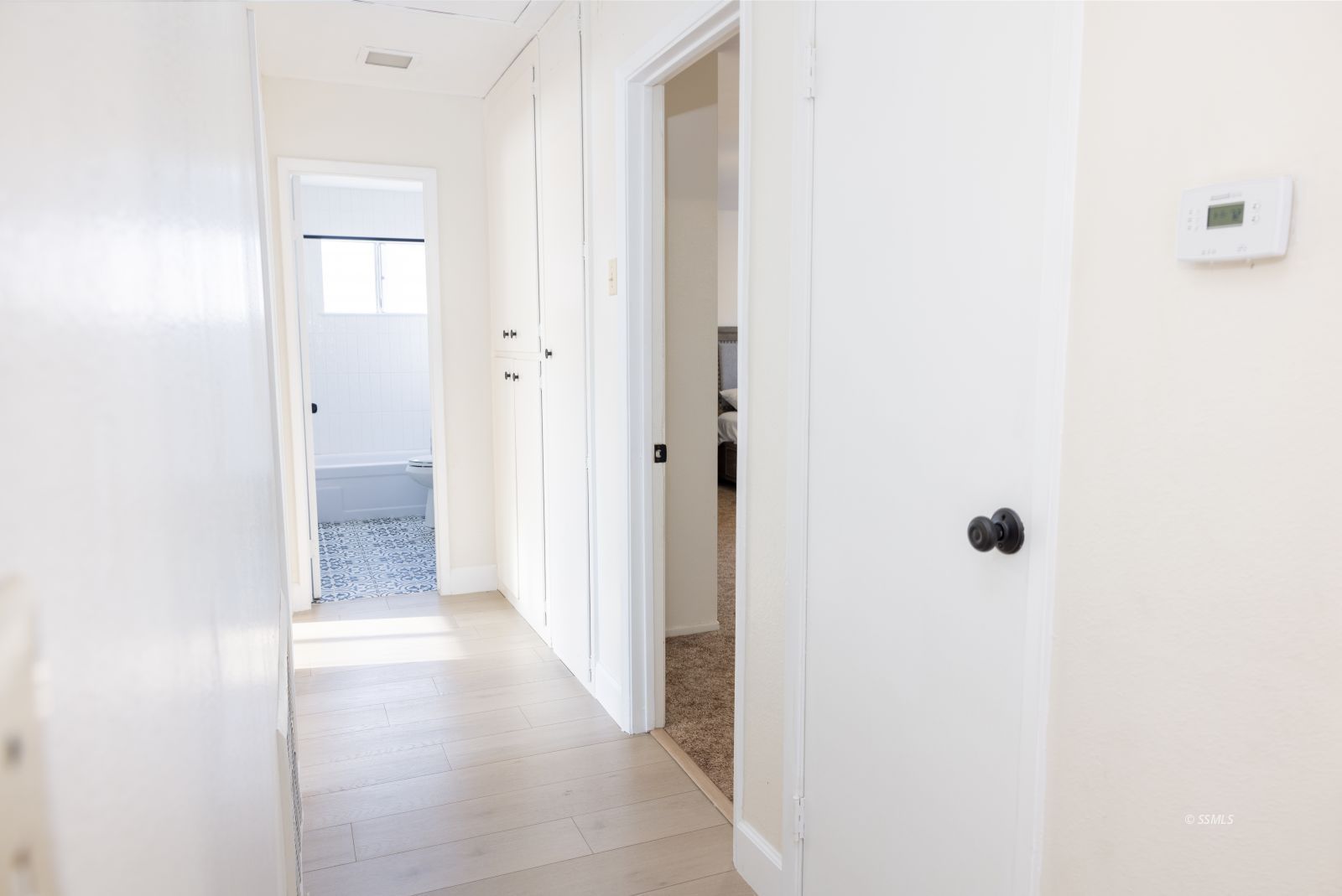 530 South Warner Street Ridgecrest, CA 93555 - Photo 18 of 32 a view of a hallway with wooden floor