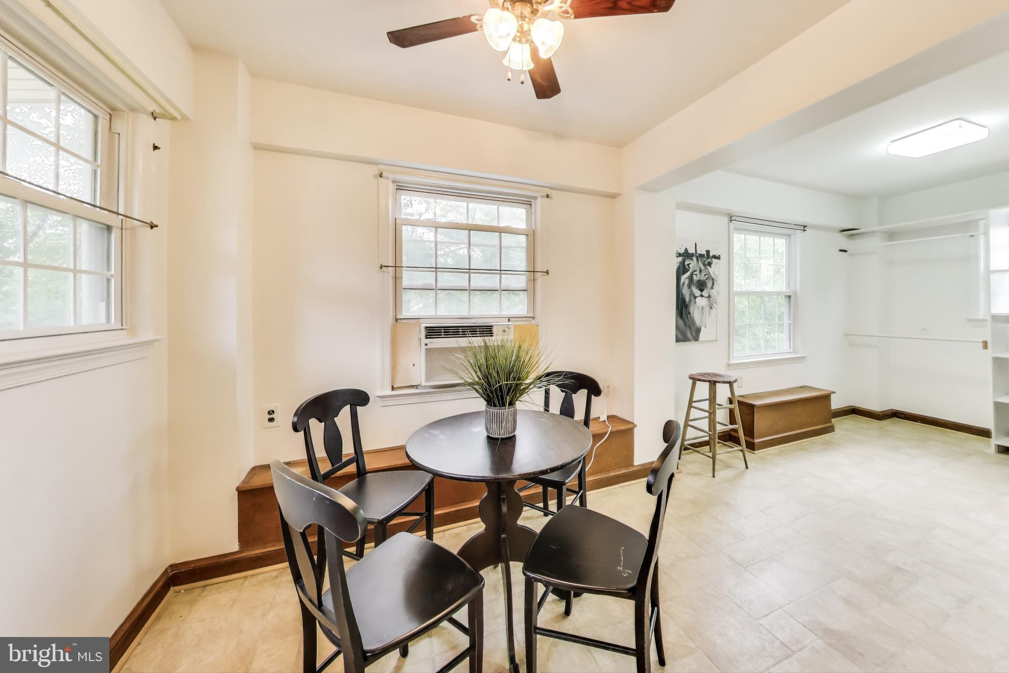 4401 32nd Street Mount Rainier, MD 20712 - Photo 11 of 38 a view of a dining room with furniture and chandelier