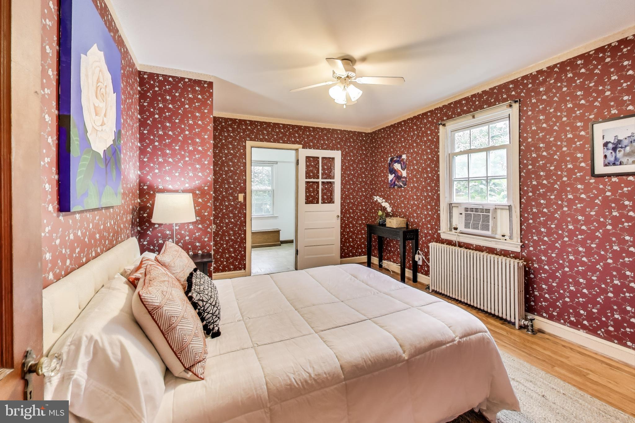 4401 32nd Street Mount Rainier, MD 20712 - Photo 15 of 38 a bed room with a bed and a chandelier