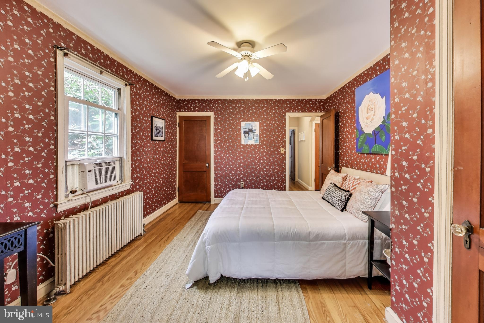 4401 32nd Street Mount Rainier, MD 20712 - Photo 16 of 38 a bedroom with a bed and a large window with outer view