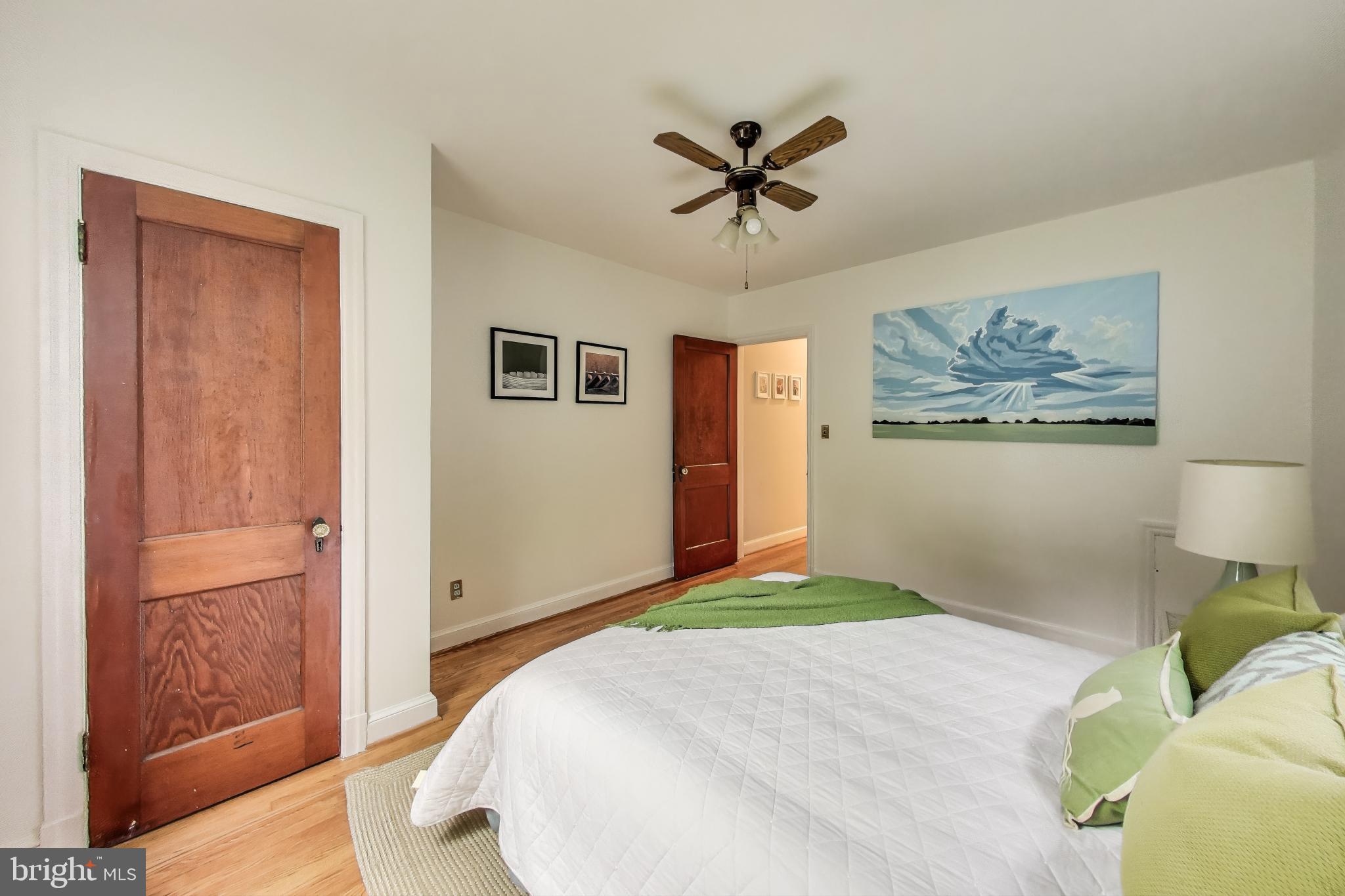 4401 32nd Street Mount Rainier, MD 20712 - Photo 18 of 38 a bedroom with a bed and a painting on the wall
