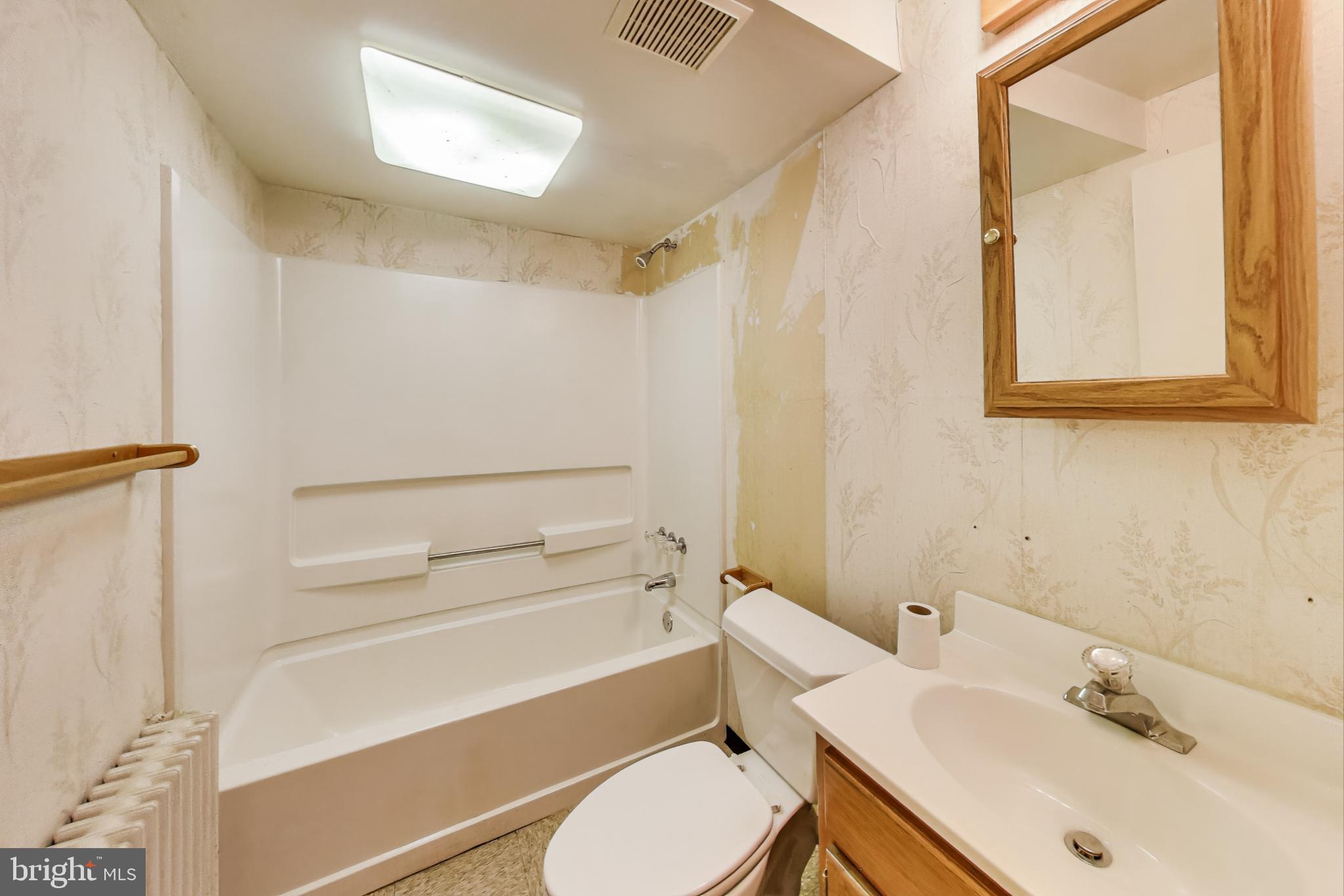 4401 32nd Street Mount Rainier, MD 20712 - Photo 25 of 38 a bathroom with a sink toilet and shower