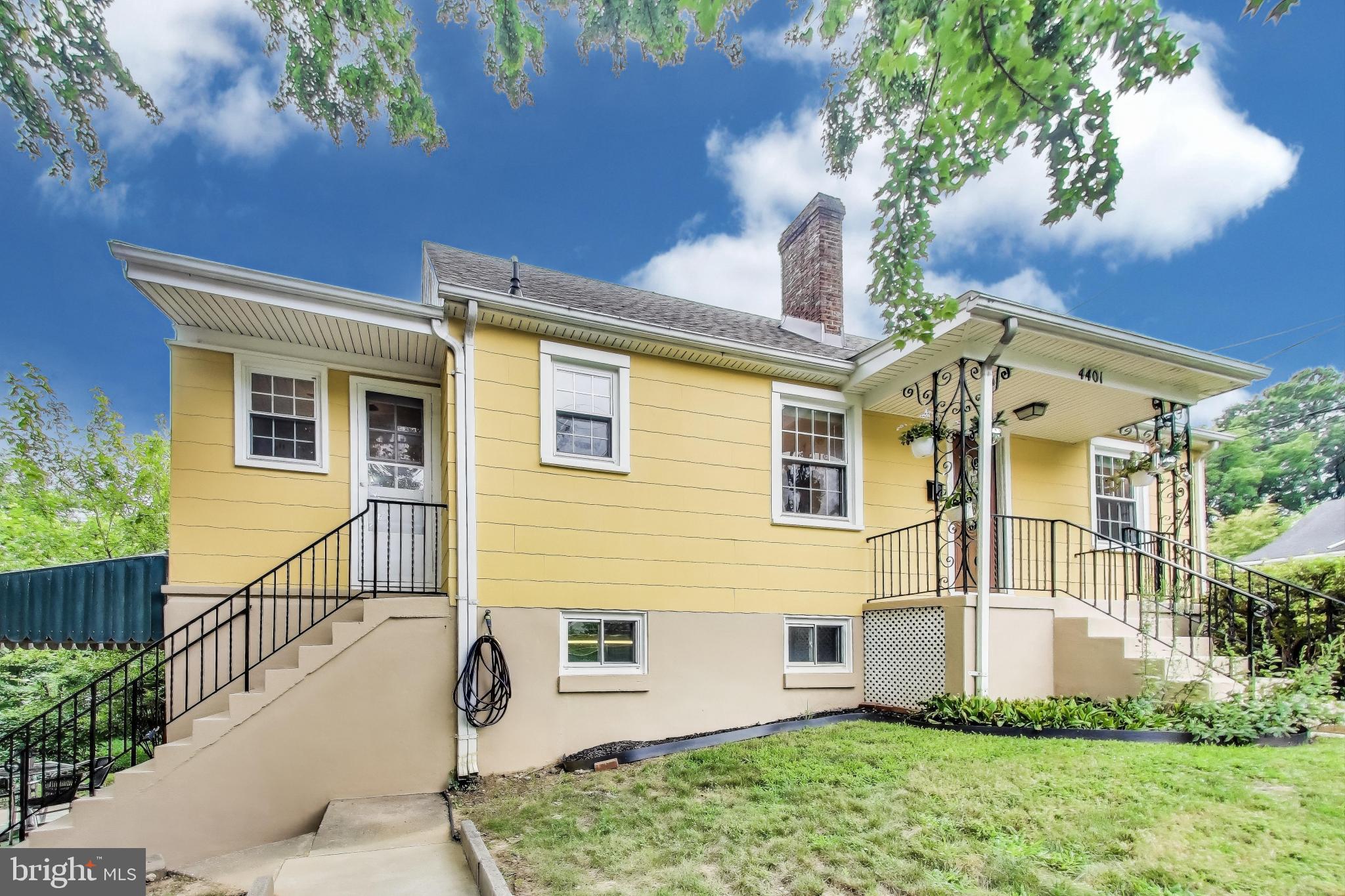 4401 32nd Street Mount Rainier, MD 20712 - Photo 4 of 38 a front view of a house with a yard