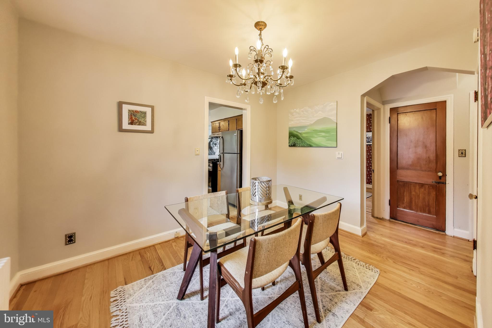 4401 32nd Street Mount Rainier, MD 20712 - Photo 6 of 38 a view of a dining room with furniture and wooden floor
