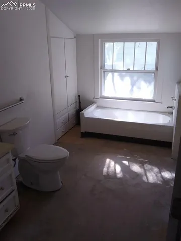 a bathroom with a toilet a sink and a bathtub