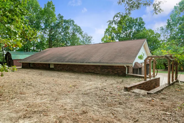 a view of front door of house with stairs