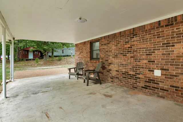 a view of a yard with a tree