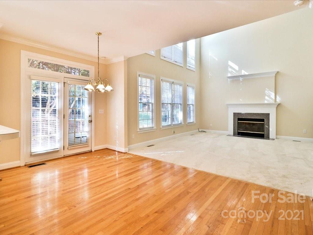 3426 Rhett Butler Place Charlotte, NC 28270 - Photo 14 of 40 a view of an empty room with window and fire place