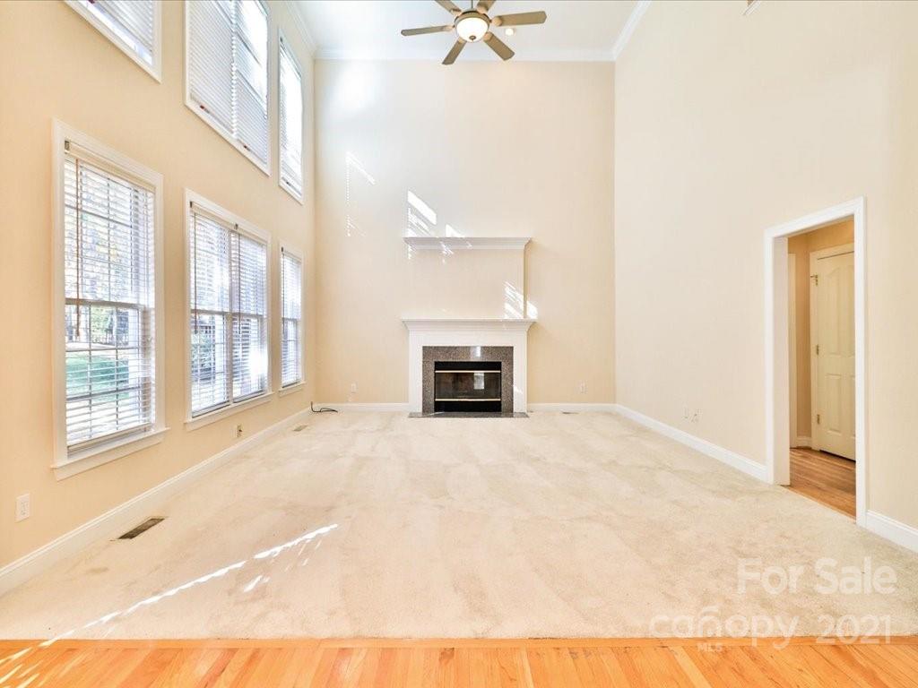 3426 Rhett Butler Place Charlotte, NC 28270 - Photo 16 of 40 a view of an empty room with a fireplace