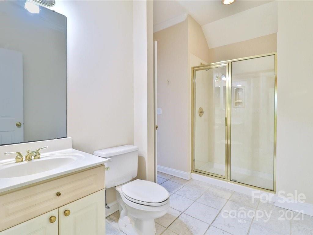 3426 Rhett Butler Place Charlotte, NC 28270 - Photo 20 of 40 a bathroom with a granite countertop sink toilet and shower