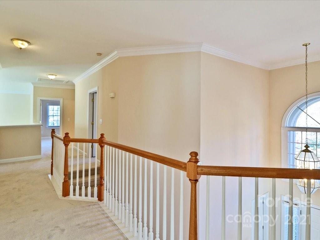 3426 Rhett Butler Place Charlotte, NC 28270 - Photo 22 of 40 a view of a hallway with windows