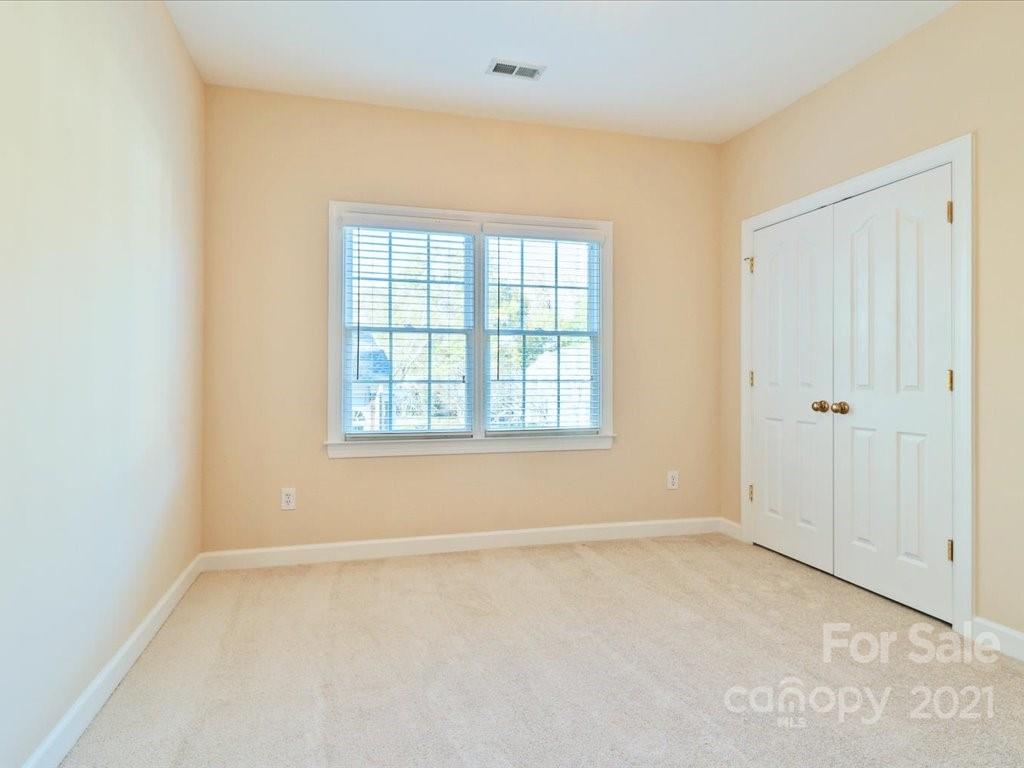 3426 Rhett Butler Place Charlotte, NC 28270 - Photo 33 of 40 an empty room with a empty space and windows