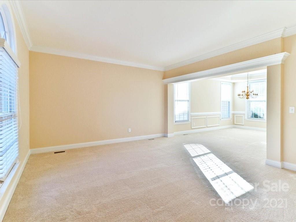 3426 Rhett Butler Place Charlotte, NC 28270 - Photo 5 of 40 an empty room with wooden floor and windows