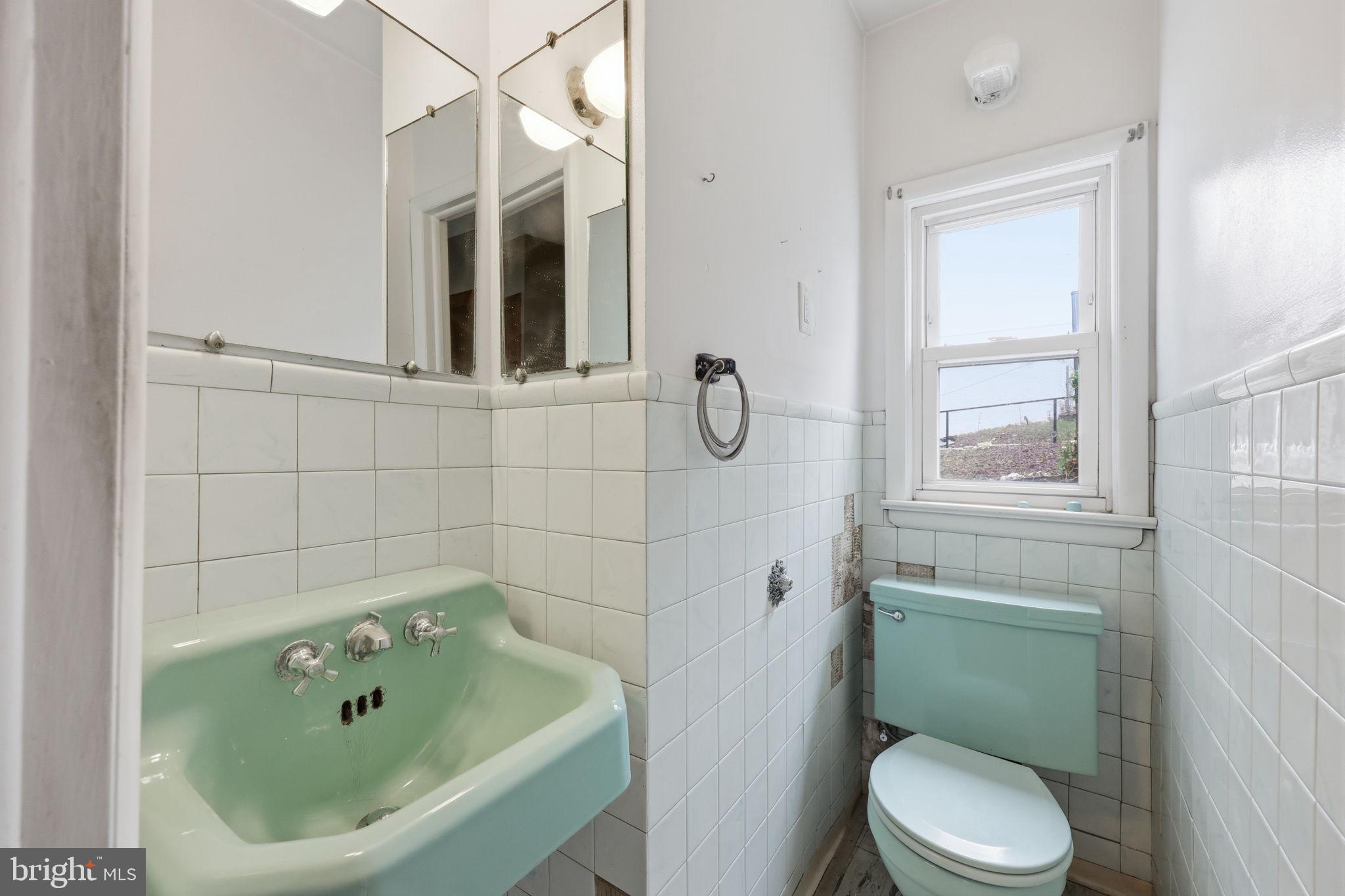 353 Hermitage Street Philadelphia, PA 19128 - Photo 17 of 31 a bathroom with a sink and a toilet