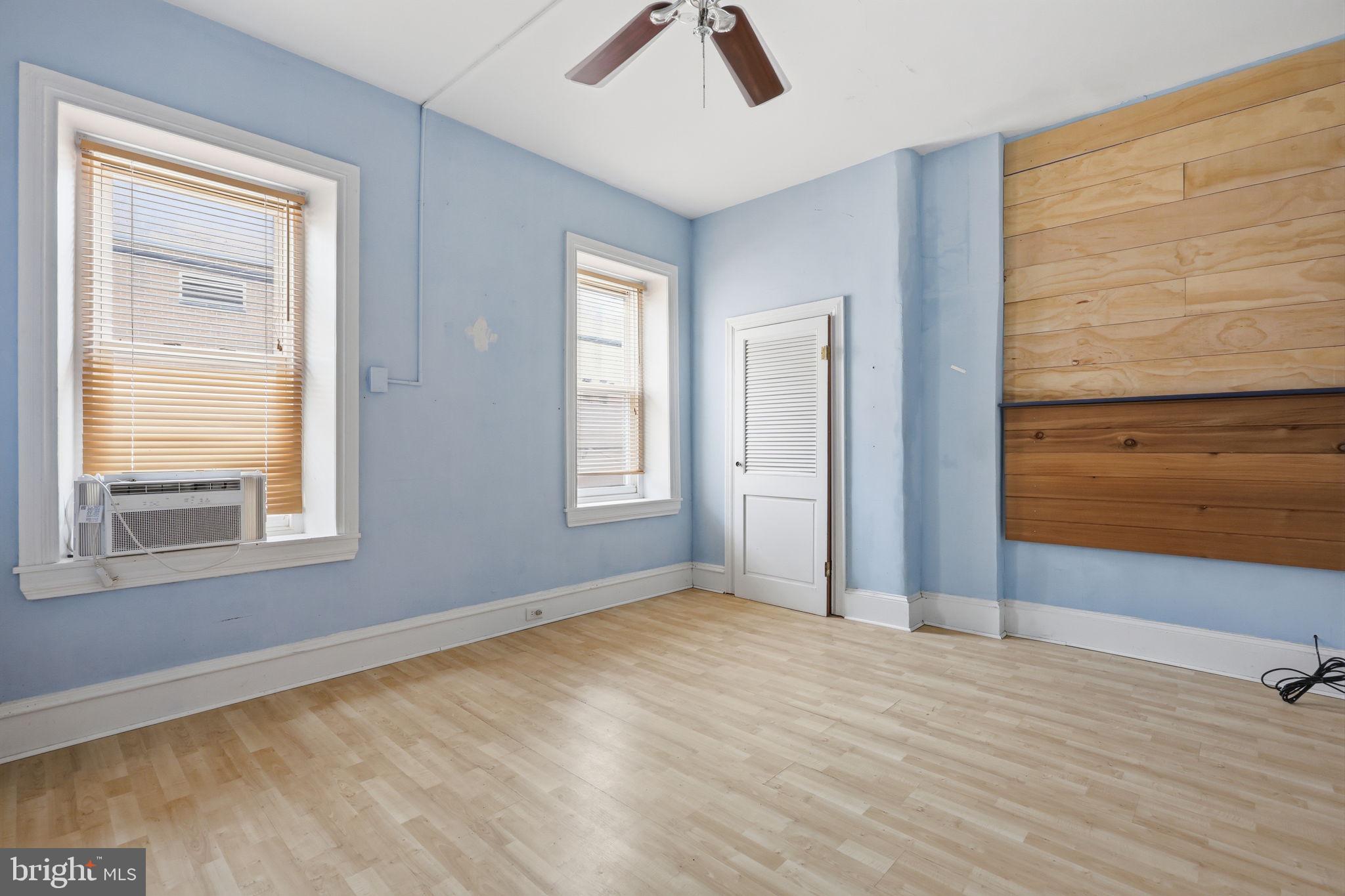 353 Hermitage Street Philadelphia, PA 19128 - Photo 20 of 31 a view of an empty room with window and wooden floor