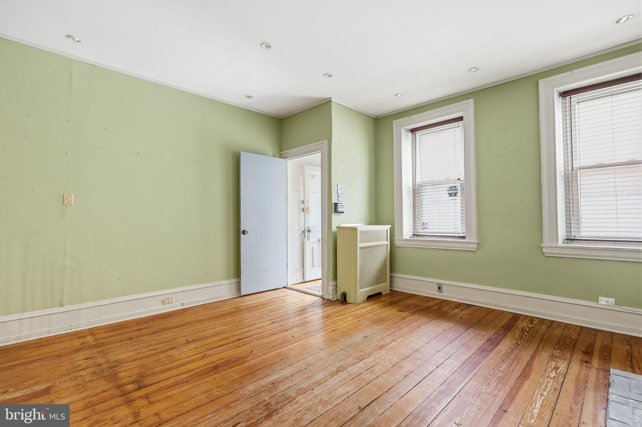 353 Hermitage Street Philadelphia, PA 19128 - Photo 6 of 31 a view of empty room with wooden floor and fan