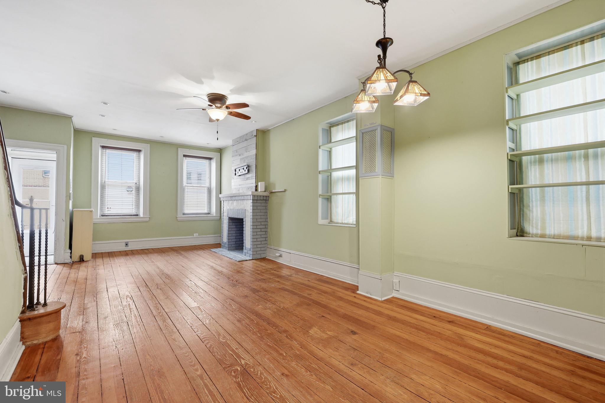 353 Hermitage Street Philadelphia, PA 19128 - Photo 8 of 31 a view of an empty room with a window and wooden floor