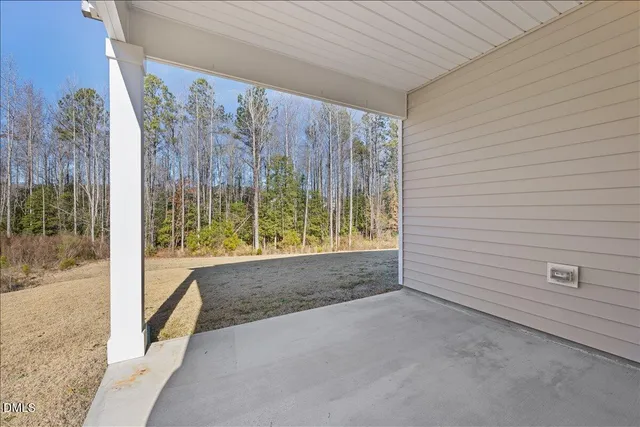 a view of a house with a snow on the road