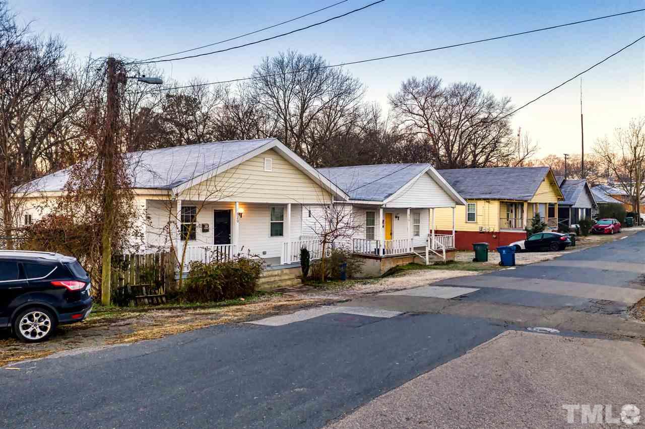 910 Gilbert Street Durham, NC 27701 - Photo 22 of 24 a view of a house with a cars park side of a road