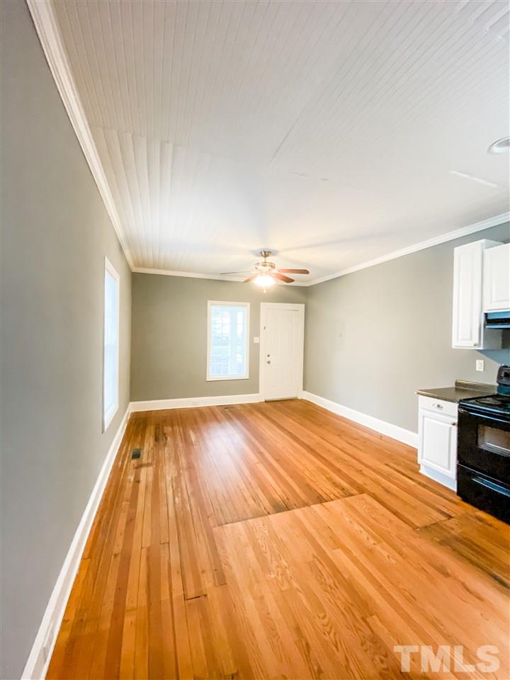910 Gilbert Street Durham, NC 27701 - Photo 10 of 24 a view of empty room with wooden floor