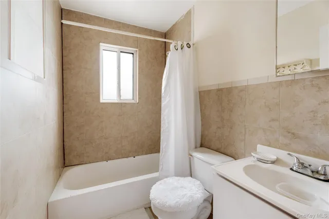 a bathroom with a sink toilet and bathtub