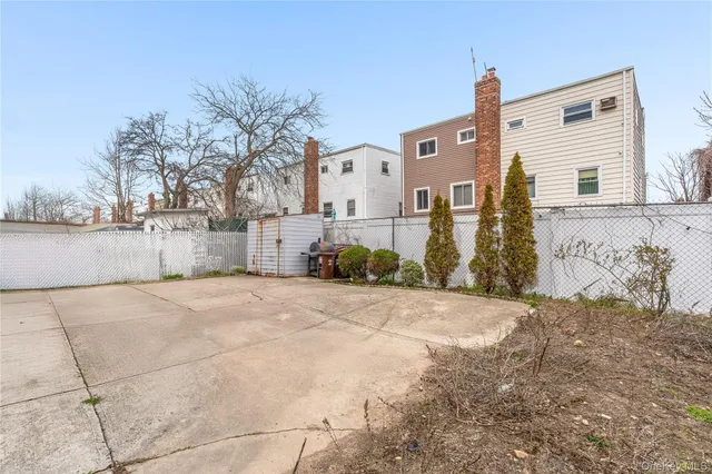 a view of a house with snow on the road