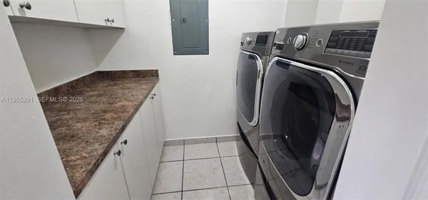 a view of storage and utility room with washer and dryer