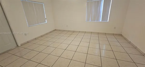 a view of an empty room and utility room