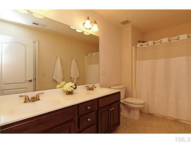 4604 Zaldivar Way Raleigh, NC 27612 - Photo 17 of 23 The second floor has a full bath with tile and a tub/shower. Bathroom