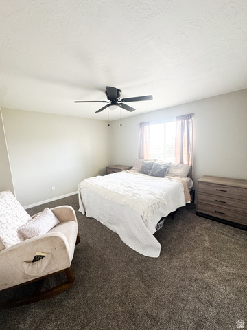 680 Timpie Road Tooele, UT 84074 - Photo 18 of 31 Carpeted room featuring a ceiling fan with integrated lighting, neutral wall tones, and a window with blinds