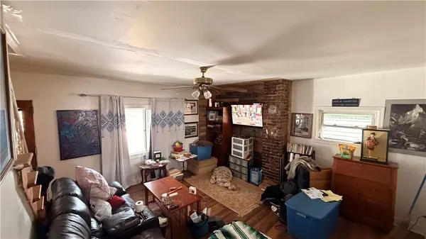 a living room with furniture a dining table and chairs