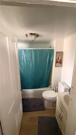 a bedroom with bed and a window