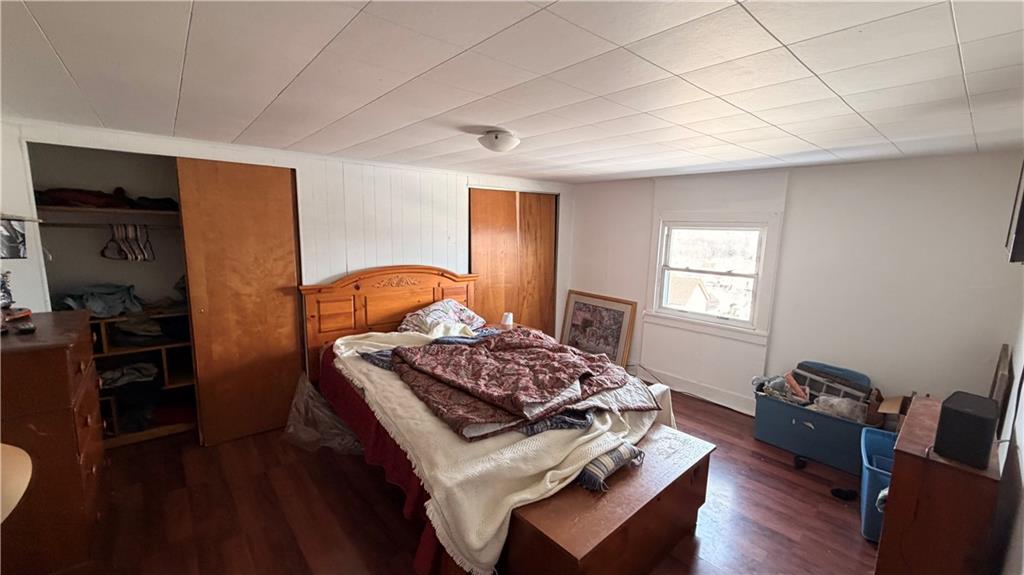 327 Lowell Street Vandergrift, PA 15690 - Photo 9 of 16 a bedroom with bed and a window